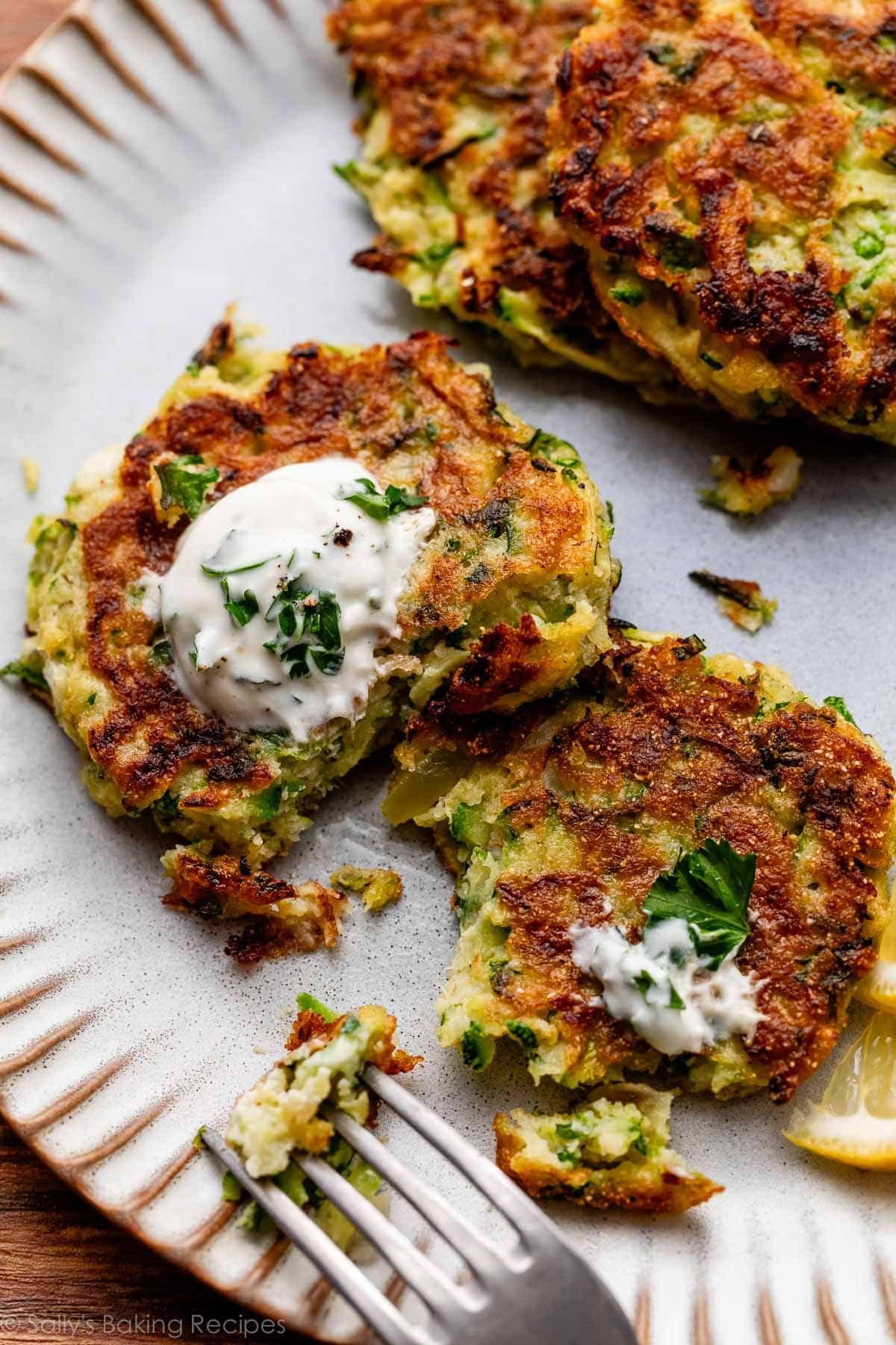 zucchini fritter cut open on plate.