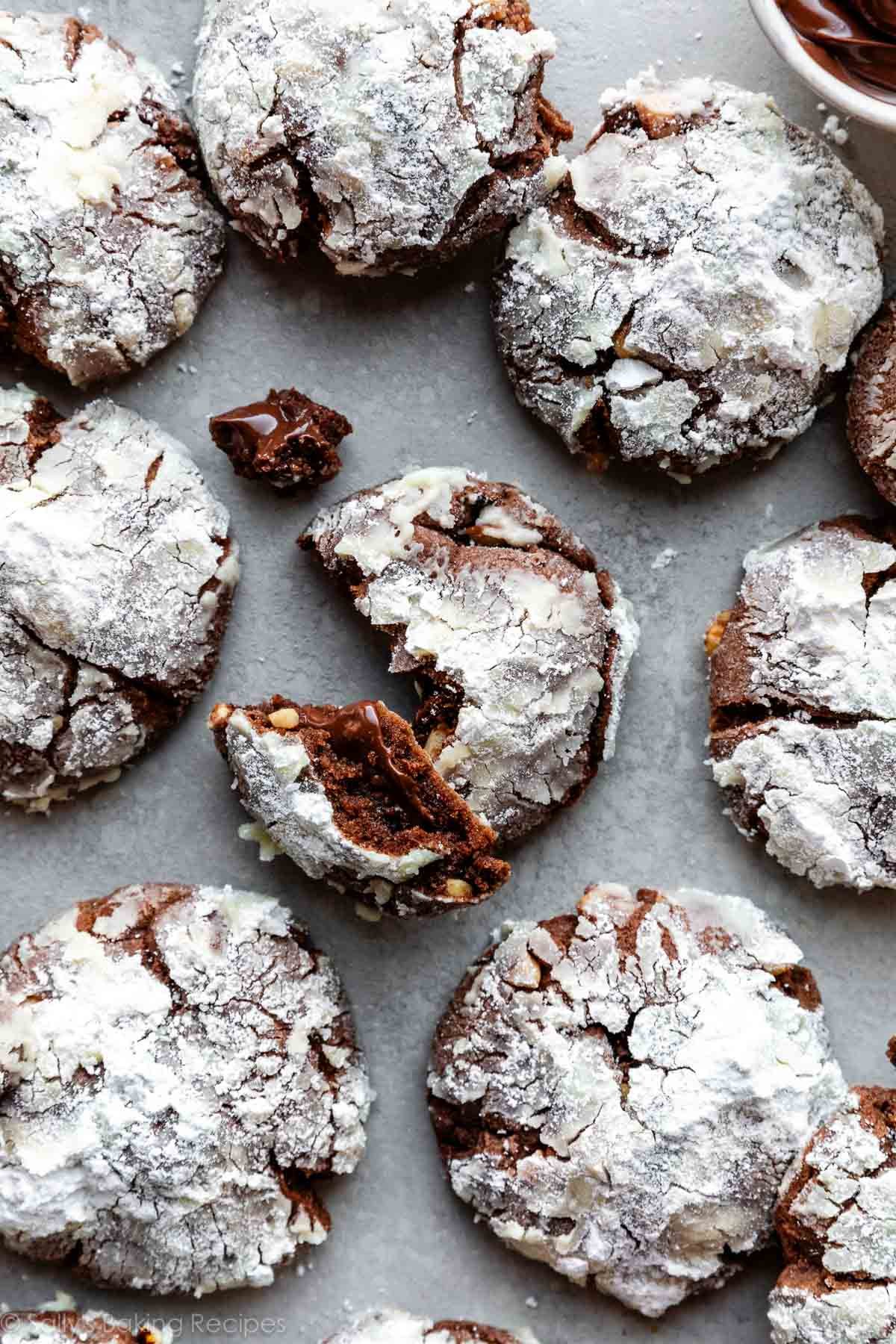 overhead photo of Nutella crinkle cookies covered in confectioners' sugar.