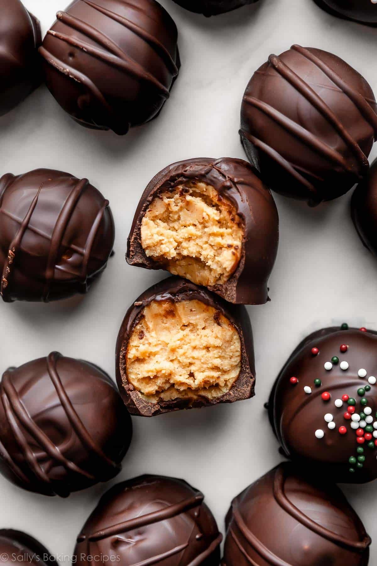 overhead photo of chocolate-covered peanut butter balls with sprinkles on top.