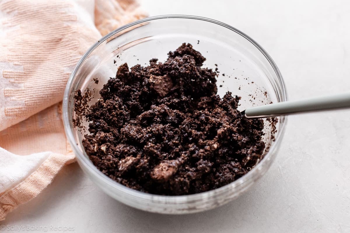 crushed Oreo cookies in glass bowl.