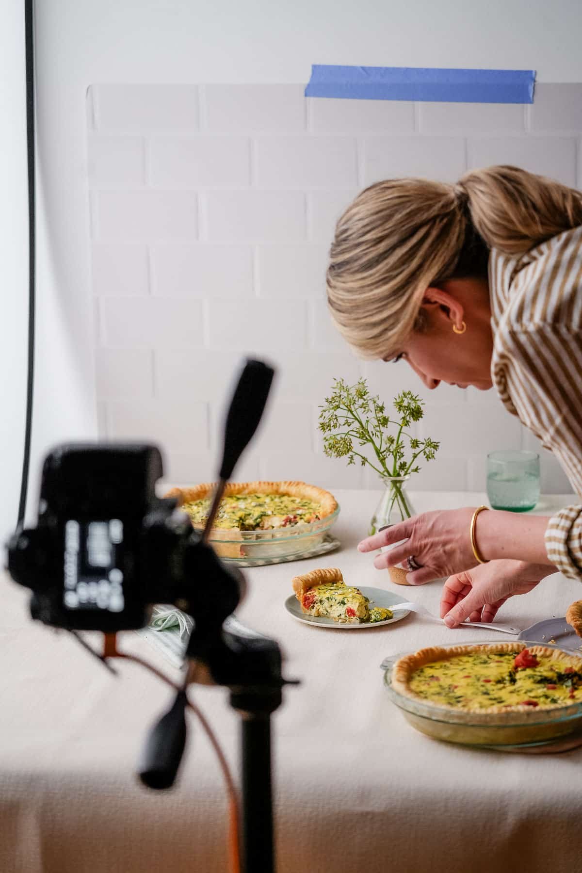 behind-the-scenes photo of Sally styling a quiche scene.