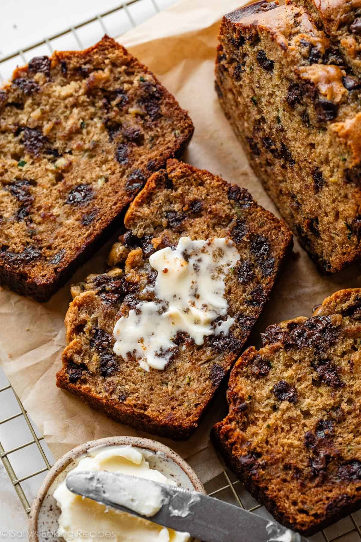 peanut butter zucchini bread with butter spread on top of a slice.