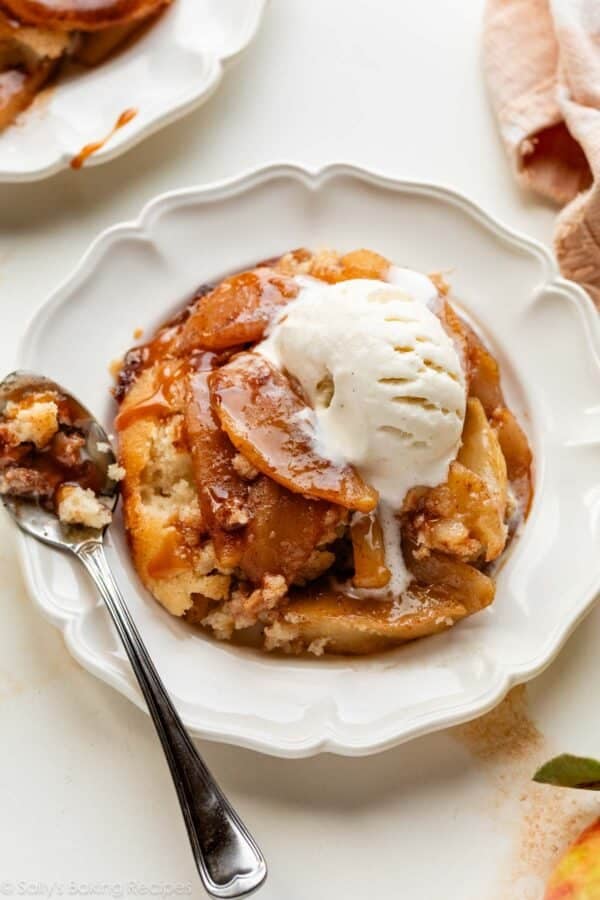 apple dessert on white plate with vanilla ice cream.