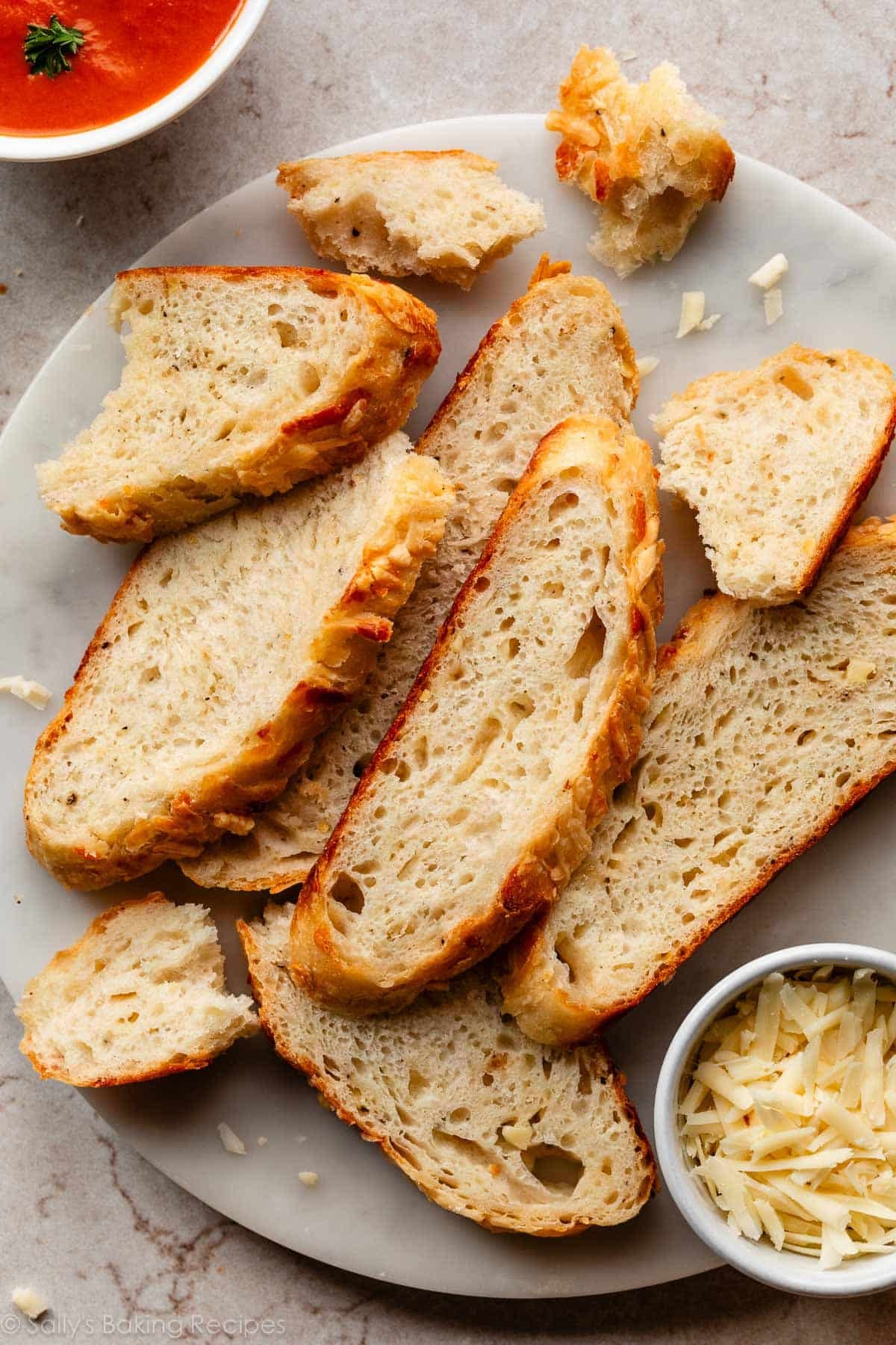 slices of asiago bread on marble platter.